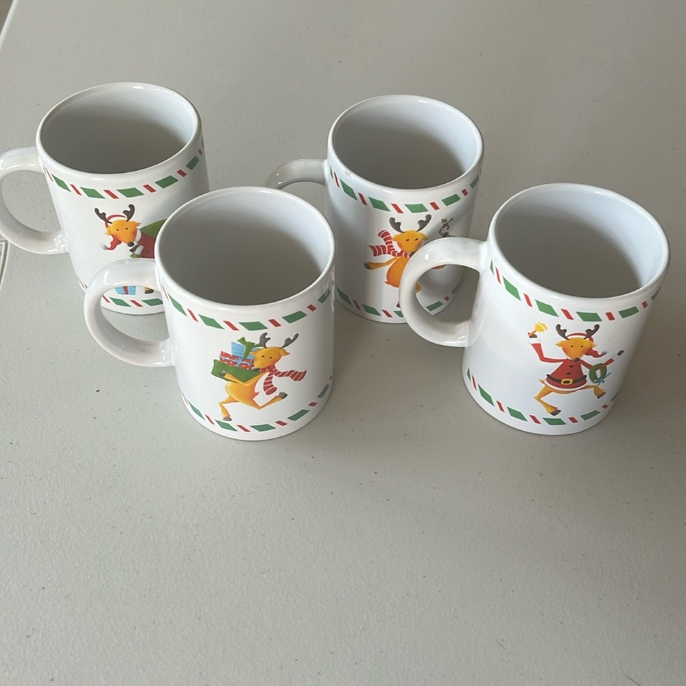 Set of Four Reindeer Mugs in a Tin